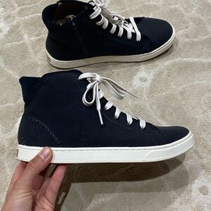 OluKai women’s black and pilahi White High-Top Sneakers